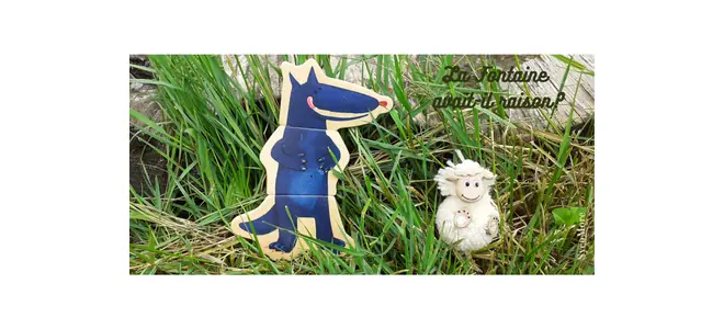 Photo : un loup et un mouton en bois dans l’herbe, avec la phrase « La Fontaine avait-il raison ? » — illustration SycoMore.