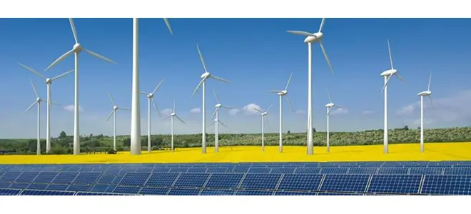 Photo : éoliennes et panneaux solaires dans un paysage agricole